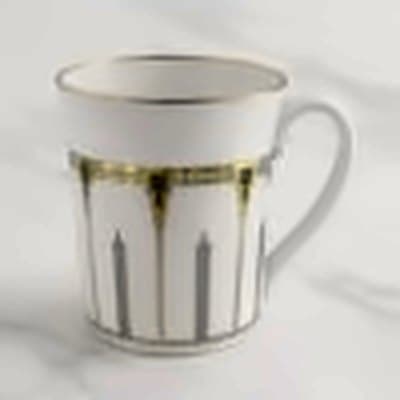 White mug with a green and gold classical column pattern